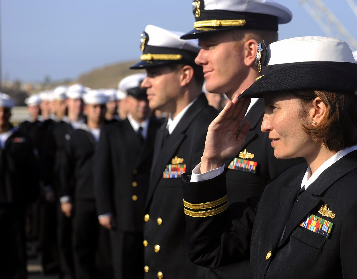 Port of Salalah — US Navy 090925-N-5345W-001 Operations Officer Lt. Rose Goscinski, right, reports during an all hands uniform inspection on the flight deck of the amphibious dock landing ship USS Fort McHenry (LSD 43) during a port visit to Sal.jpg